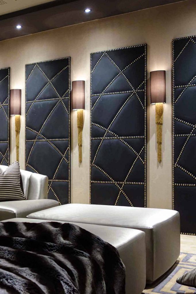 Art Deco inspired cinema room, gold wall lights, suede screens