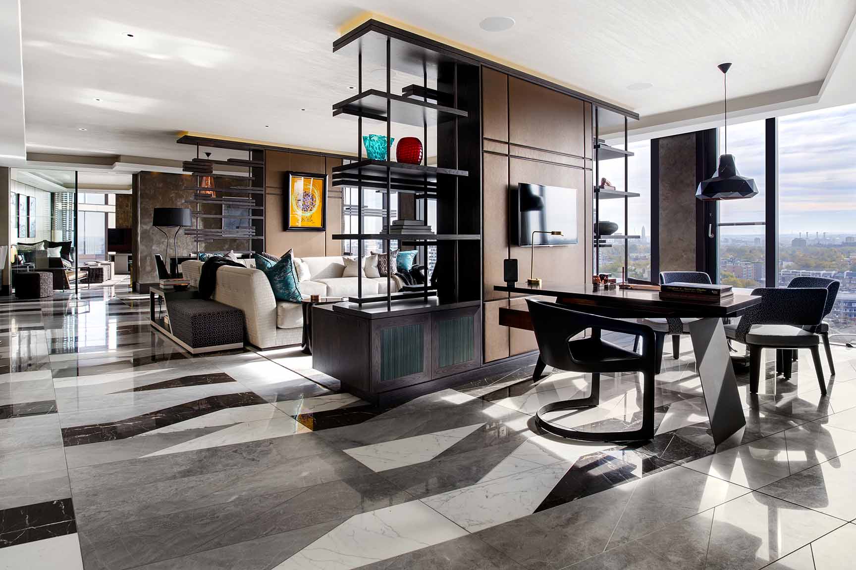 Luxurious penthouse entertainment space with bespoke marble tiled floor and small study