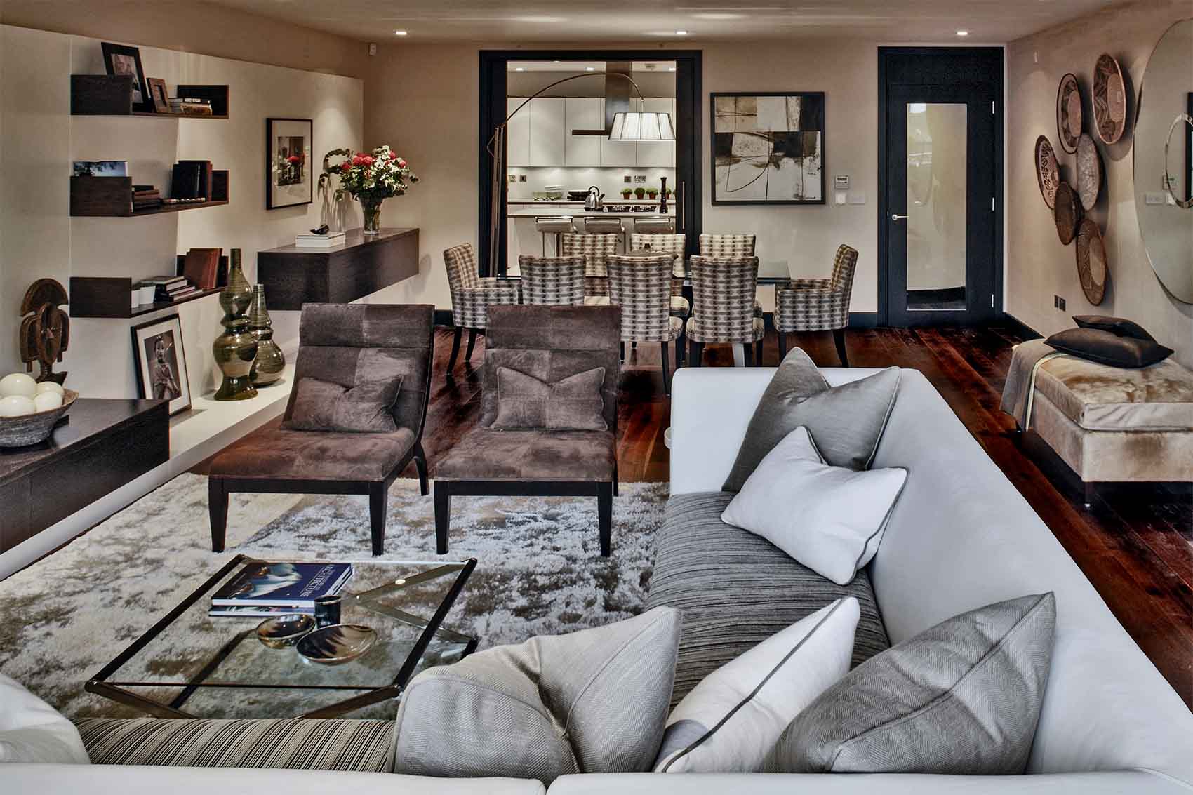 Contemporary ethnic room scene, bespoke sofa, Andrew Martin, suede chairs