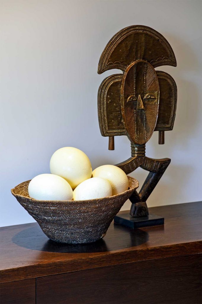 Vignette of African sculpture and ostrich eggs