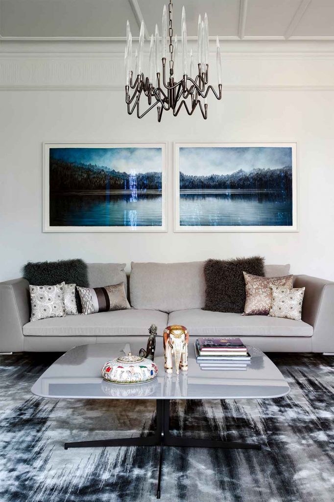 Lounge design, silk rug by Tai Ping, Minotti coffee table, B&B Italia sofa, original artwork