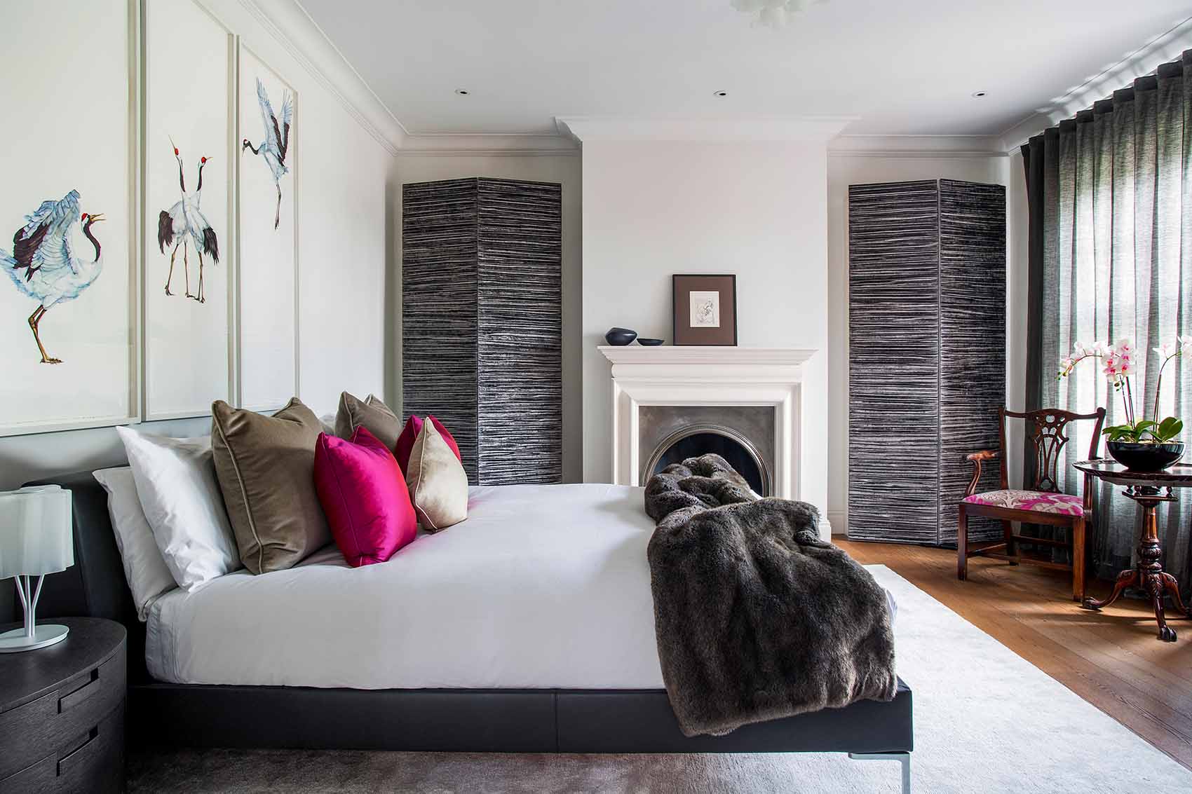 Master bedroom design by Rene Dekker, hot pink scatter cushions, faux fur throw, silk rug