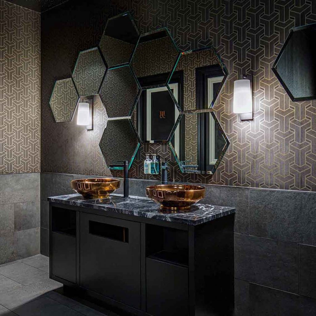 Men's restroom, concrete tiles, honeycomb mirror, dark marble vanity top