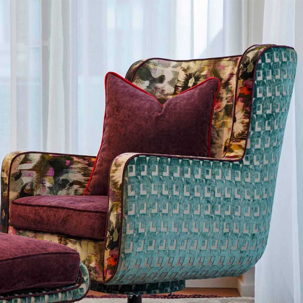 Modern armchair, multicolour velvet fabrics, purlple catter cushion, furniture design