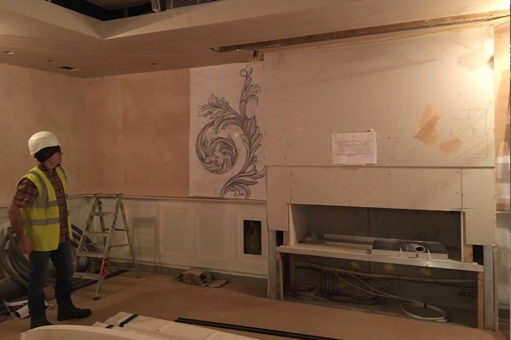 Artist on site developing design of acanthus leaf, full scale drawing