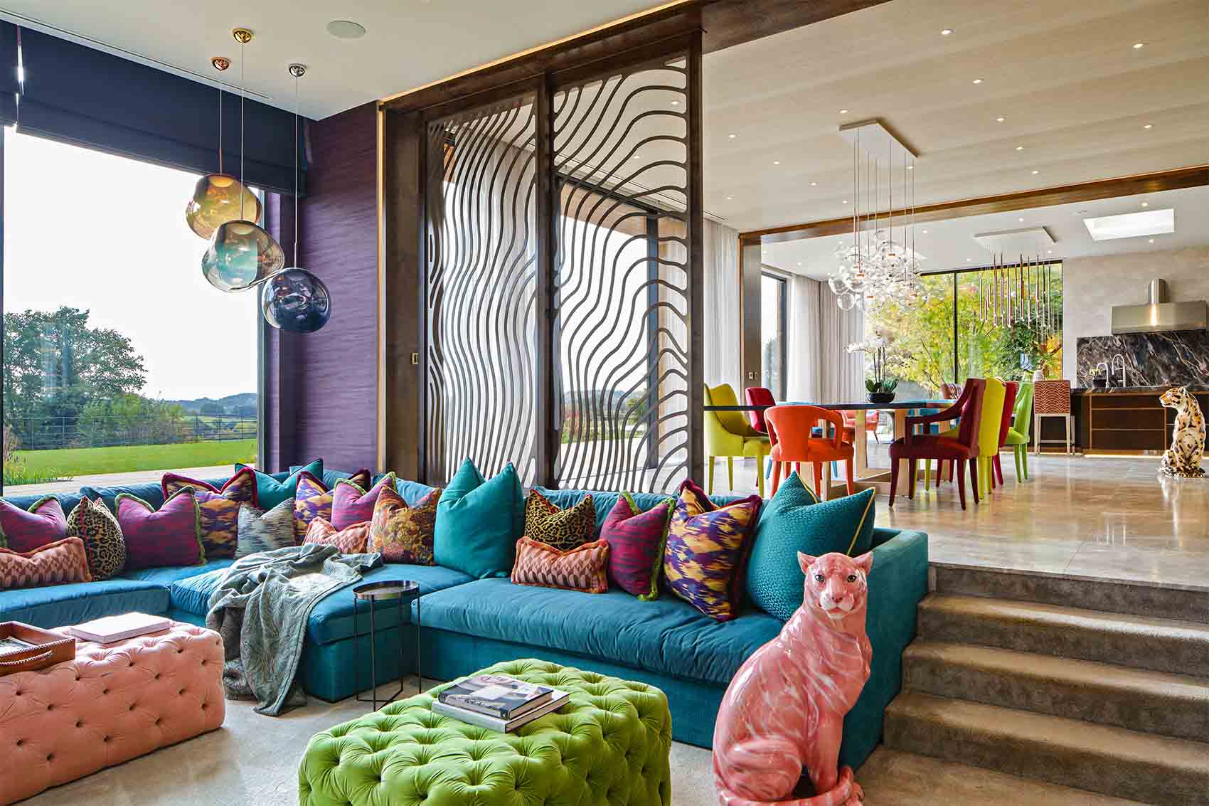 Bright colourful luxury family room, scatter cushions, pink panther, turquoise sofa, marble floor