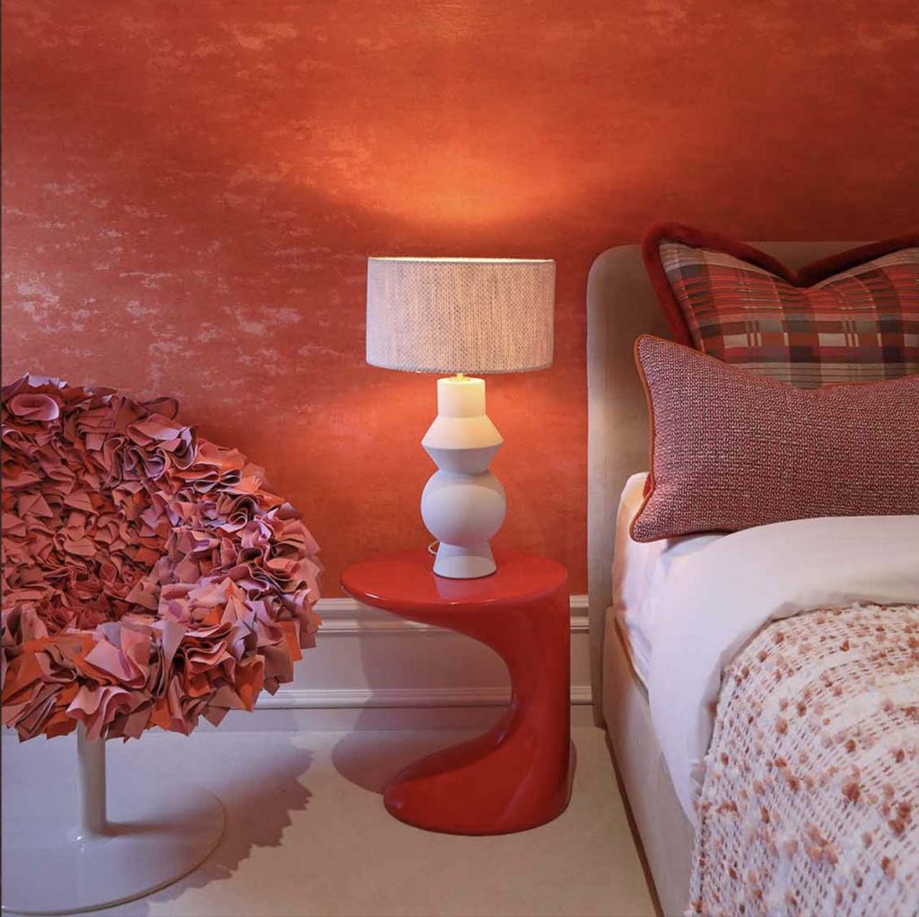 Luxe orange guest bedroom, colourful scatter cushions, luxury design